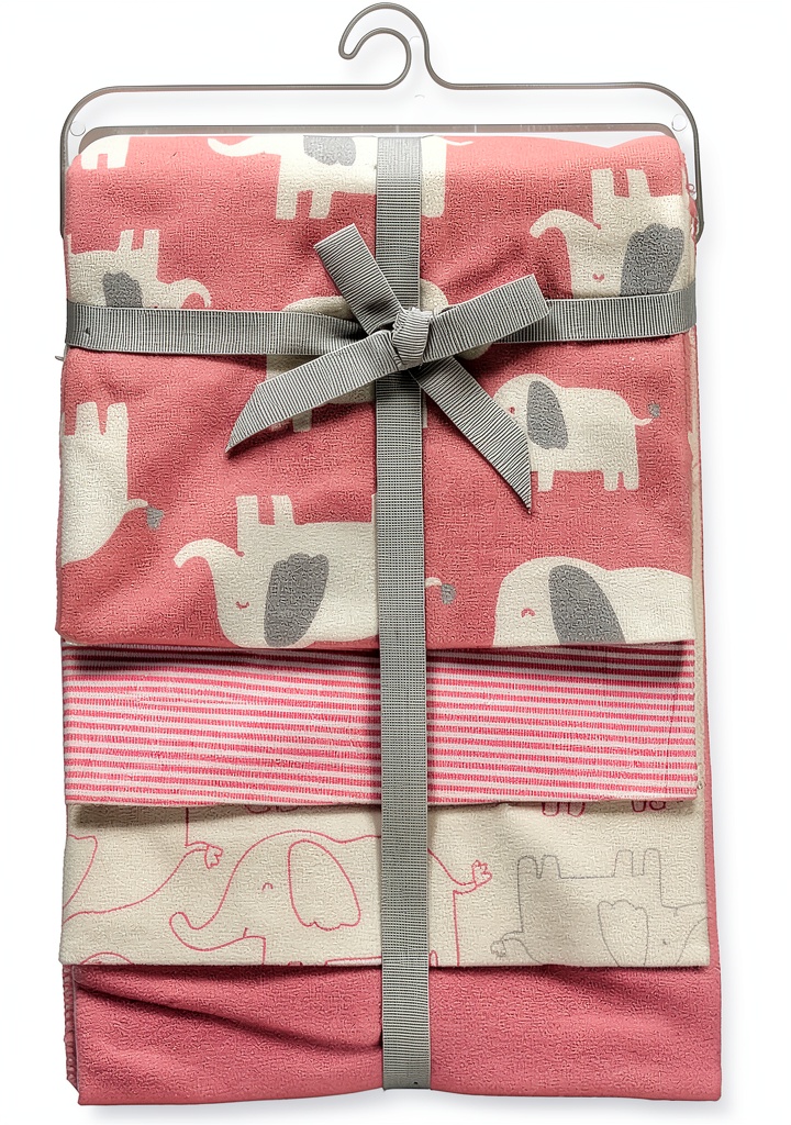 Baby wrapped in Carter's elephant print receiving blanket on a soft nursery rug